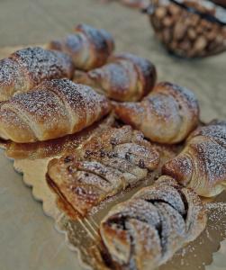 a bunch of pastries sitting on a glass plate at B&BPodere1149 in Villafranca