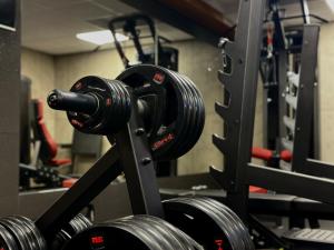 a gym with two dumbbells on a machine at Apartamenty A&M Premium in Stargard