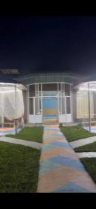 a house with a walkway in front of it at Узбечка in Tashkent