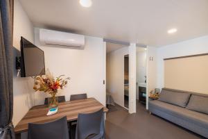 a living room with a table and a couch at House no 3 in Pakoštane