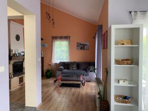 a living room with a couch and a table at Patrick House in Tivat