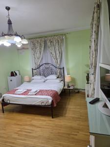 a bedroom with a large bed in a room at Bucharest Boutique Accommodation by Hotels in Bucharest