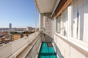 a balcony with a view of a city at Fratelli Bandiera in Latina