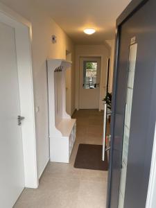 a hallway of a house with a stairway at Seeidylle in Geeste