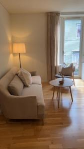 a living room with a couch and a table at Blue House Odda in Odda