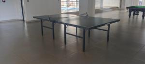 a black table in a room with a pool table at Fun-fantastic Furnished Apartment, The Loftel near UN, Embassies, Two Rivers & Village Market,with a Pool and Gym in Nairobi