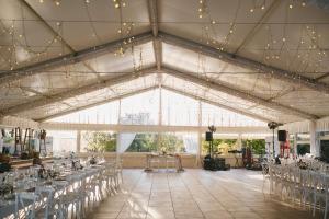 a banquet hall with tables and chairs and lights at Masseria Ancella in Montalbano +113 photos