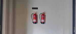 two fire hydrants are hanging on a wall at Fun-fantastic Furnished Apartment, The Loftel near UN, Embassies, Two Rivers & Village Market,with a Pool and Gym in Nairobi +13 photos