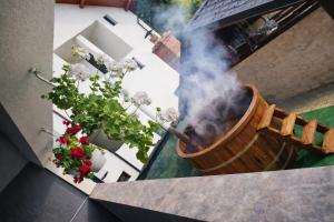 a pot with smoke coming out of it on a balcony at Casa de vacanta Naty in Colibiţa