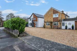 an empty driveway in front of a house at Winterbourne House in Fleet