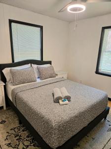 a bedroom with a bed with two pillows on it at Cozy Cabin 2 beds Mtn view in Franklin