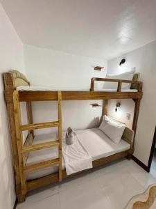 a couple of bunk beds in a room at Camila Hostel Coron in Coron