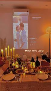a table with a picture of a bride and groom at Huế Nestory Homestay in Thôn Trường Giang +25 photos
