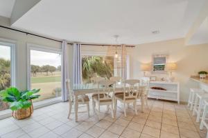 a kitchen and dining room with a table and chairs at Spinnaker 753 in Seabrook Island