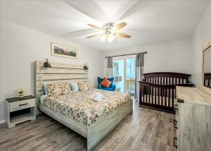 a bedroom with a bed and a crib at Pocono nirvana in East Stroudsburg +76 photos