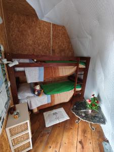 a doll house with two bunk beds in it at Agriturismo Glamping Erbe Matte in SantʼAntìoco +164 photos