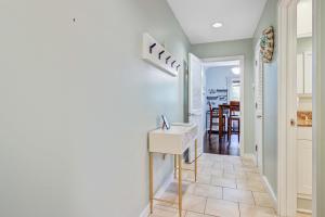 a hallway with a table and a staircase in a house at Mariner's Watch 4267 in Kiawah Island