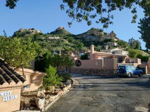 a car parked in a parking lot in front of houses at Cedra 5, Holiday home, cosy apartment in Turre