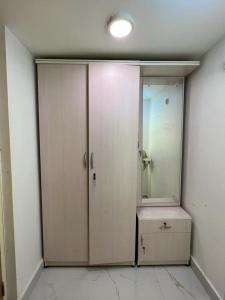 an empty room with a shower and a mirror at Pappu niwas in Siliguri