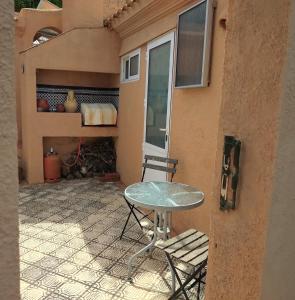 a patio with a table and chairs and a fireplace at Cedra 5, Holiday home, cosy apartment in Turre