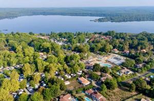 an aerial view of a park next to a lake at Mobilhome camping Rivage des Landes in Aureilhan