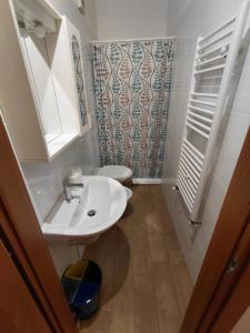 a bathroom with a sink and a toilet at Le Stanze sul Colle in Palo del Colle