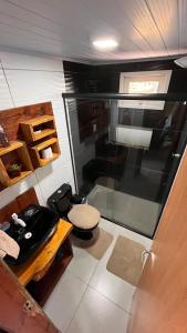 a small bathroom with a toilet and a sink at Morada das Estrelas in Cambará +78 photos
