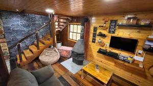 an overhead view of a living room with a fireplace at Morada das Estrelas in Cambará
