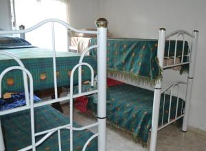 two bunk beds in a room with a bed at Amanecer en Cuyo in San Rafael