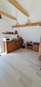 a large room with a bed and wooden cabinets at Pension am Bach Prinz Charming in Fuldatal