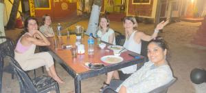 a group of women sitting at a table at Adam's Heaven in Alleppey +2 photos