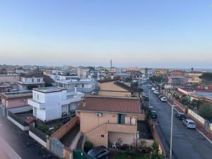 a view of a city with buildings and a street at Luisella house in Isola Sacra