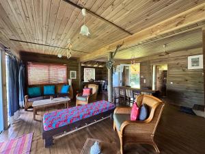 a living room with couches and chairs in a house at Vaka House in HUH
