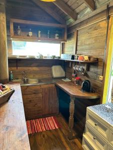 a small kitchen with a sink and a counter at Vaka House in HUH