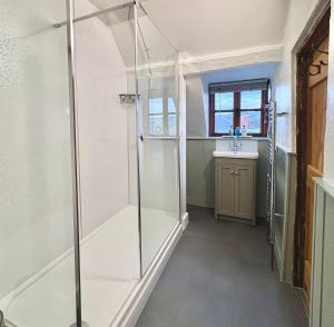 a bathroom with a shower and a sink at Number 22, Castle Street in Hay-on-Wye +22 photos