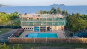 a building under construction with a swimming pool at Lorateng' Resort - Rusinga in Mbita