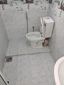a bathroom with a toilet and a sink at Home mr in Matara