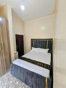 a bedroom with a large bed in a room at Deripacs Homes in Lodwar