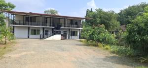 an empty road in front of a house at Bhagya Resort Limited in Nikawatawana