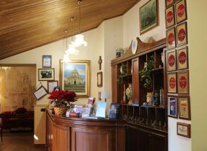 a shop with a wooden counter in a room at Hotel Il Barocco in Ragusa +52 photos