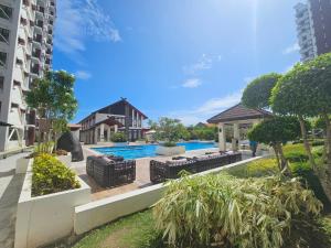 an image of a swimming pool in a building at Ubec Vacation Home - Royal Oceancrest Mactan Cebu Condominium in Cebu City
