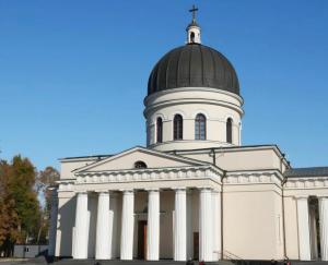 a large white building with a black dome at Central Apartment Facing the Cathedral in Chişinău