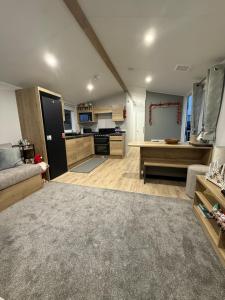 a large kitchen and living room with a couch at The Ellerton at Eyemouth in Eyemouth