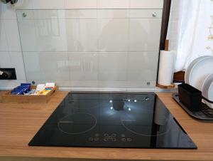 a black mat on the floor in a kitchen at Palma's house in Cambiago
