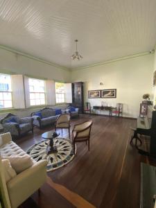 a living room with a couch and a table at Maria Candida Hospedaria in Areias