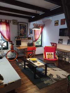 a living room filled with furniture and a table at Guesthouse Silvani in Kruševac