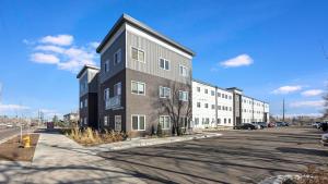 a large apartment building on the side of a street at Landing Apartments - 2720 S Federal in Englewood