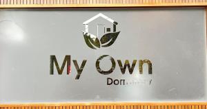 a sign for myowm with a house on it at My own dormitory in Cochin