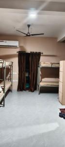 a room with bunk beds and a ceiling at My own dormitory in Cochin