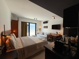 a hotel room with a bed and a couch at Memento Agriturismo in Cervia +64 photos